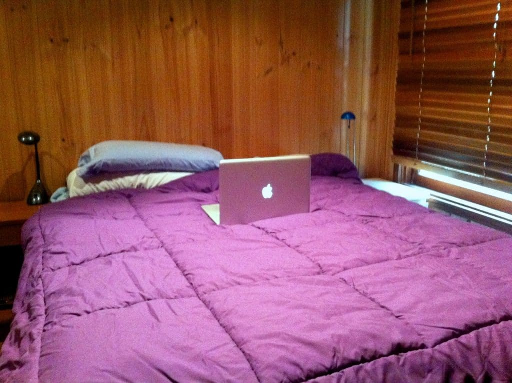 purple mattress - Purple Mattress and laptop in a room